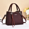 Chic burgundy woven tote bag with top handles, metal logo and adjustable strap - Burgundy