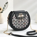 Mini round black crossbody bag with swan buckle, geometric cutout, and gold chain strap - 18cmx17cmx9cm / Black