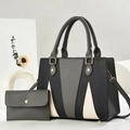 Detail of tricolor leather tote bag set with lychee grain texture and gold hardware - Gray