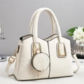 Detail of cream soft leather handbag with gold hardware and mini round coin purse - Off White