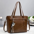 Classic brown leather tote bag with detachable strap and sneaker charm detail - Brown