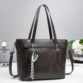 Deep brown leather tote bag with stylish sneaker charm for modern women's daily commute - Gray