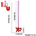 Detailed view of pink beaded Valentine necklace with red glitter XO heart shaped pendant - XO Style