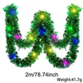 Ghirlanda San Patrizio da 2m verde con trifogli e luci LED colorate incorporate - Ghirlanda Irlandese (Con Luce) / 2 Metri