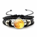 Detail of woven leather bracelet featuring a moon pattern glass cabochon and metal beads - Yellow Moon (JY002073-7)