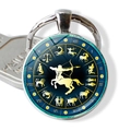 Creative glass Sagittarius zodiac keychain with silver ring and deep blue star pattern - Sagittarius