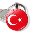 Detailed macro view of silver glass keychain featuring the Turkish flag emblem - Turkey