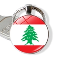 Macro shot of Lebanon flag keychain with glass dome and silver alloy ring detailing - Lebanon Flag