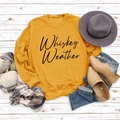 Flat lay of mustard yellow sweatshirt with Whiskey Weather lettering and autumn accessories - Yellow Sweatshirt (Black Font)
