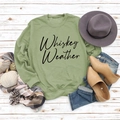 Flat lay of Whiskey Weather green sweatshirt with autumn boots and accessories - Olive Green Sweatshirt (Black Font)