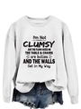 Detail of white crewneck sweatshirt with black typography slogan and ribbed cuffs - White