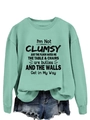 Detail of mint green long sleeve sweatshirt with black humorous graphic text print - Light Green