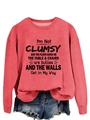 Detail of red crewneck sweatshirt featuring black humorous text with denim shorts - Red (Black Font)