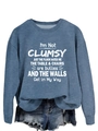 Detailed fabric texture of blue crewneck sweatshirt with white slogan print on white background - Blue (White Text)