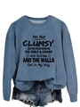 Detail of blue-grey crewneck sweatshirt featuring I'M NOT CLUMSY JUST THE slogan print - Blue (Black Text)