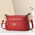 Dark red lychee leather crossbody bag with kangaroo logo and gold zippers - Burgundy