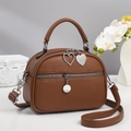 Brown litchi grain crossbody bag with double silver zippers and heart pendants - Earthy Yellow