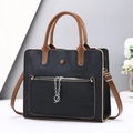 Large black and brown leather tote bag with geometric stitching and silver chain charm - Black