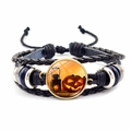 Macro detail of Halloween pumpkin pattern on vintage bronze woven leather bracelet - Pumpkin & Lantern Style (JY002586-2)