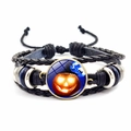 Macro detail of Halloween woven leather bracelet with glowing pumpkin glass cabochon - Pumpkin & Witch Hat Style (JY002586-4)