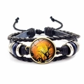 Detail view of Halloween braided leather bracelet with pumpkin glass dome and metallic beads - Pumpkin & Castle Bat Style (JY002586-8)