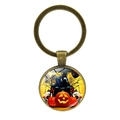 Λήψη macro του μπρελόκ Halloween με σχέδιο κολοκύθας και κρανίου σε μπρούτζο - Στυλ Σιλουέτα Τρόμου Και Κρανίο (JY002553-4)