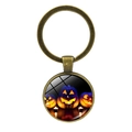 Detail of vintage bronze Halloween keychain featuring carved Jack-O-Lantern glass cabochon - Three Pumpkins And Candles Style (JY002553-7)