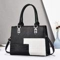 Luxe handtas van PU-leer met contrasterende gewatteerde en krokodillenstructuur - Zwart