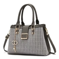 Dark gray textured crossbody handbag with wheat pattern and golden hardware accents - Gray