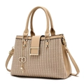 Detail of beige crossbody bag showing V-weave texture and golden ring pendant accessory - Light Khaki