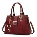 Detailed close-up of wine red woven texture handbag with golden hardware and key pendant - Burgundy