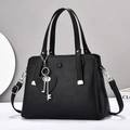 Large black leather tote bag with silver heart charm and adjustable shoulder strap - Medium (28x20x12cm) / Black