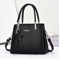 Elegante bolso de mano en cuero negro con colgante de estrella y correa para oficina - Negro