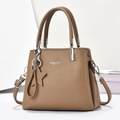 Caramel brown pebbled leather tote bag with star charm and adjustable silver hardware strap - Dark Khaki