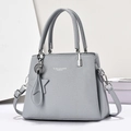 Bolso de mano gris en cuero granulado con adornos de plata y estrella - Azul