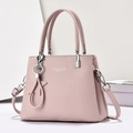 Pink lychee grain leather handbag with star charm and detachable shoulder strap detail - Pink