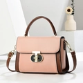 Bolso de mano en contraste rosa y marrón con cierre en T dorado y correa ajustable - Rosa