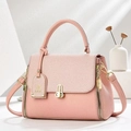 Elegant pink lychee leather crossbody bag with woven flap and gold metal hardware - Pink