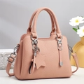 Pink lychee grain leather handbag with top handles and adjustable crossbody strap - Pink