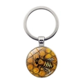 Zilveren sleutelhanger met ronde glazen hanger, gele koninginnenbij en honingraat patroon - Zilver