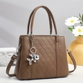 Deep brown quilted crossbody tote bag with silver balloon dog charm and top handles - Brown