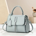 Chic blue-gray crossbody handbag with lychee pattern leather and tassel detail - Blue