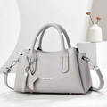 Elegante hellgraue Handtasche aus Leder mit Litschi-Struktur und abnehmbarem Gurt - Grau