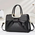 Elegant black leather handbag with woven pattern and golden U-shaped handle buckles - Black