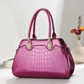 Magenta embossed crocodile leather tote bag with elegant gold shell hardware - Purple