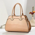 Detail of glossy apricot crocodile embossed handbag with golden shell buckle closure - Khaki