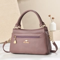 Elegante malvenfarbene Handtasche mit Litschi-Struktur und goldener Reißverschlusstasche - Lila