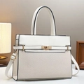 Detail view of woven leather tote bag with gold twist lock and adjustable strap - Off White