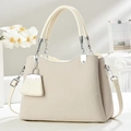 Elegant beige woven texture handbag for women with small pendant and detachable strap - Off White