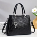 Elegante borsa a mano nera da donna con trama intrecciata e dettagli in argento - Nero